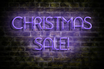 Christmas Sale. Neon inscription on the background of an old brick wall. Business. Trade. Sales Seasonal sales.