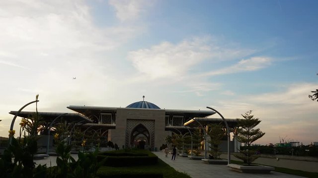Beautiful sunset time lapse view of Tuanku Mizan Zainal Abidin Mosque or Iron Mosque by the Putrajaya lake in Putrajaya, Malaysia.Zoom In