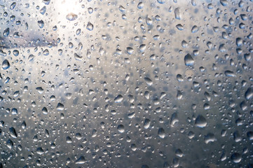 background of raindrops on window glass, close up