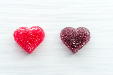 Two multi-colored hearts on a white background. Concept love, romance, lovers, couple.