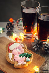 New Year's gingerbread in the form of a pig decorated with icing