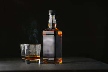 bottle and glass of whiskey
