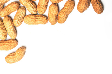 Pile of roasted peanuts on a white background