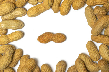 Pile of roasted peanuts on a white background