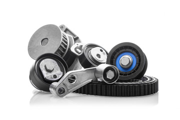 kit of timing belt with rollers on a white background