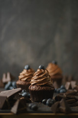 Delicious muffins with blueberries and chocolate cream