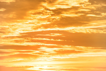 Naklejka na ściany i meble Orange sunset sky with clouds for nature background