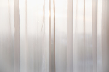 Obraz premium Defocused curtain window and stationery box with sunlight.