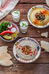 Eggplant dip baba ganoush with bread and vegetables, copy space