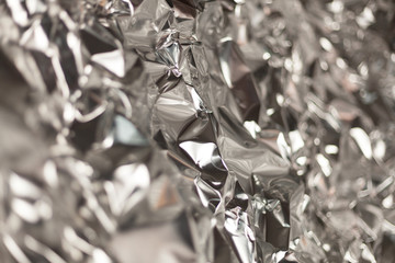 Full frame take of a sheeT of crumpled silver aluminum foil