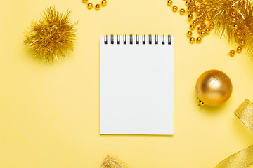 Golden Christmas flat lay with empty note book for your text. Top view, new year plan.