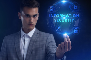 The concept of business, technology, the Internet and the network. A young entrepreneur working on a virtual screen of the future and sees the inscription: Information security