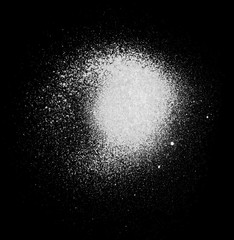 Realistic grunge graffiti spray paint effect on the black background. Isolated white ink texture.