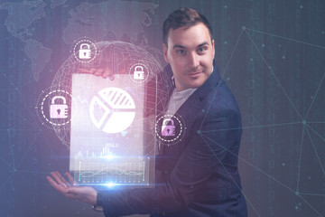 The concept of business, technology, the Internet and the network. A young entrepreneur working on...