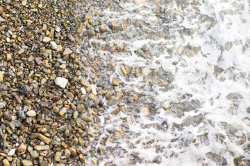 Beach stone background with sea	