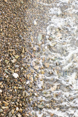 Beach stone background with sea	