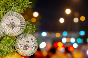 Glass ball ornaments on a Christmas tree and blurred lights. with clipping path.