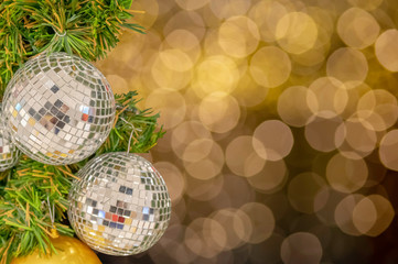 Glass ball ornaments on a Christmas tree and blurred lights. with clipping path.