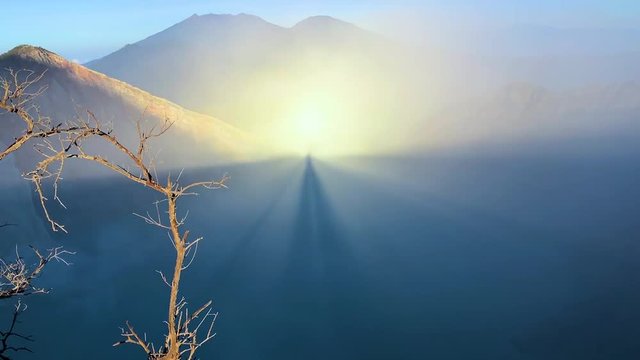 Beautiful sunrise with gloriola effect at the top of volcano Kawah Ijen, East Java, Indonesia, Asia