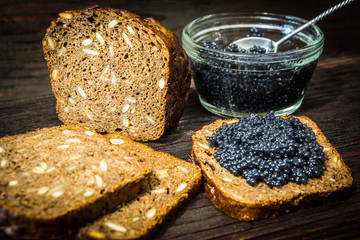 Sandwiches with caviar. Preparation of sandwiches. Place for your text.