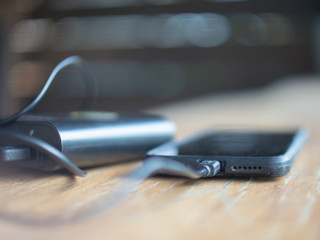 Smartphone is charging by usb port outside, powerbank