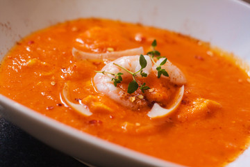 Bouillabaisse soup. Delicious fish soup with shimps, fish fillet and vegetables.