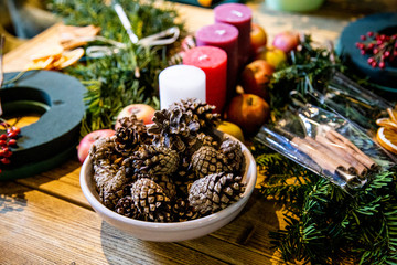 bumps on Table with accessories for making by hand a unique magic Christmas wreath, background