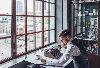 Young writer with a retro typewriter