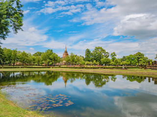 Ruin of Pagoda in Wat mahathat Temple Area and reflection in the water At sukhothai historical park,Sukhothai city Thailand