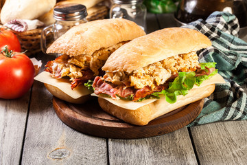 Ciabatta sandwich with smoked bacon and eggs