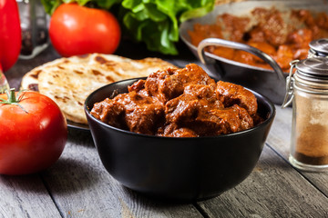 Chicken tikka masala served with bread naan