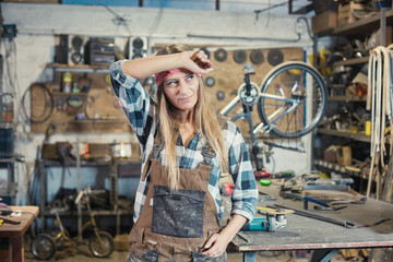 portrait of a young woman worker in a workshop