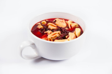 Traditional polish Christmas Eve dish: red borscht with uszka (a mushroom filled kind of dumplings)
