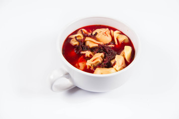 Traditional polish Christmas Eve dish: red borscht with uszka (a mushroom filled kind of dumplings)