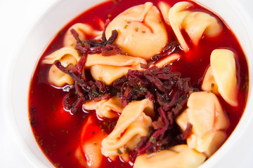Traditional polish Christmas Eve dish: red borscht with uszka (a mushroom filled kind of dumplings)