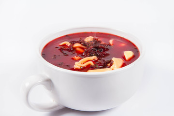 Traditional polish Christmas Eve dish: red borscht with uszka (a mushroom filled kind of dumplings)
