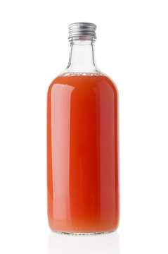 Bottle with fresh juice close up isolated on white background