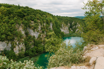 Fototapeta na wymiar Travel to Croatia. Top view of the Plitvice Lakes - a popular Croatian national park of incredible beauty with lots of greenery, lakes and waterfalls