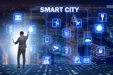 Concept of smart city with businessman pressing buttons