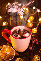 Christmas cup with hot chocolate and whipped cream.