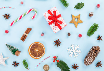 Christmas decorations on pastel color background. Top-down view.