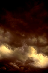 RED AND GOLD DARK THUNDERY STORM CLOUDS IN SKY