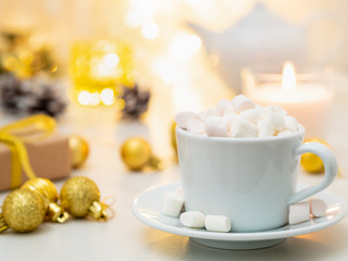 Obraz na płótnie Canvas Cocoa with marshmallow on Christmas background. Cozy evening, cup of drink, Christmas decorations, candles and lights garlands