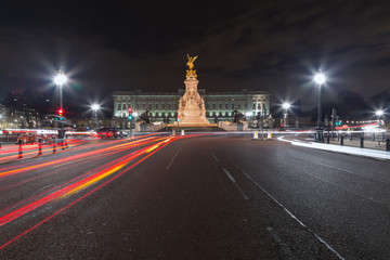 The Buckingham Palace with light trail at night 