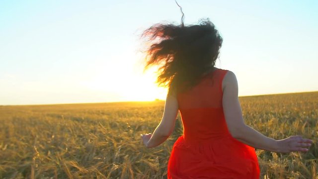 Happy traveler young hispanic beautiful woman running on wheat field in sunset summer, Freedom health happiness tourism travel happy holiday concept Beauty girl enjoying nature outdoors Sun lens flare