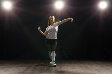 Hip-hop, jazz-funk, tecktonik, waacking, trance and street dances concept - Young woman dancing...