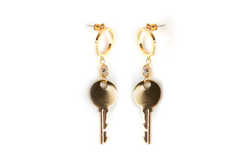 Earrings in the form of keys to the lock on a white isolated background. 2 keys from the lock on a white isolated background.