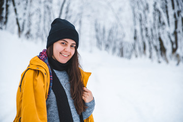 smiling woman portrait outdoors snow on hat