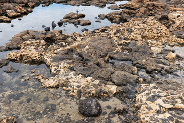 Closeup of volcanic lava stones on beach in Fuerteventura. Canary Islands