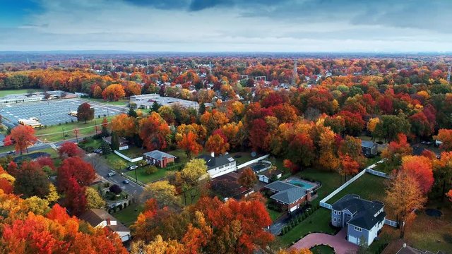 Aerial view of residential area in Autumn with colorful foliage